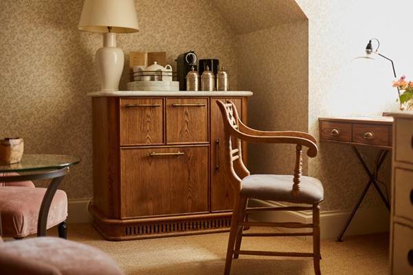A chair next to a cabinet
AI-generated content may be incorrect.