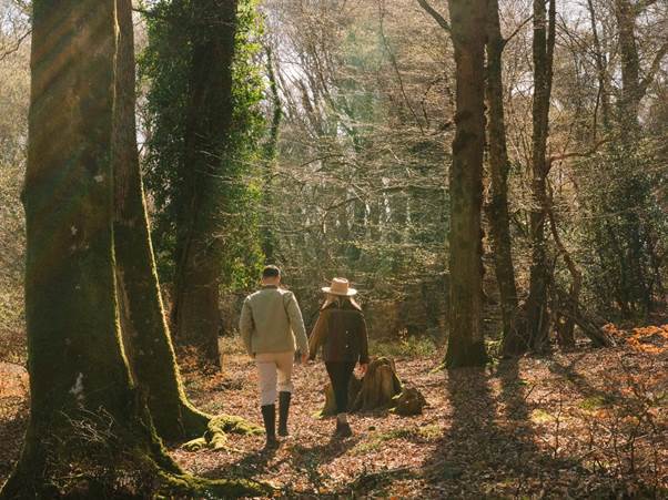 A person and person walking in the woods
AI-generated content may be incorrect.